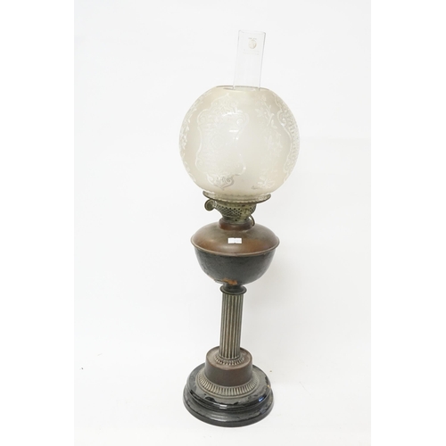 626 - A Victorian Copper & Frosted Glass Oil Lamp with Shade resting on a Carinthium Column base.