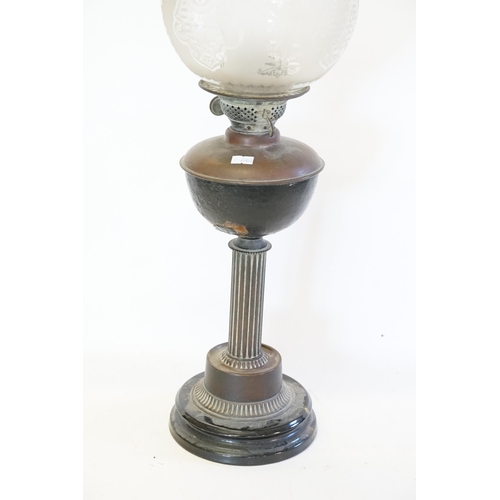 626 - A Victorian Copper & Frosted Glass Oil Lamp with Shade resting on a Carinthium Column base.