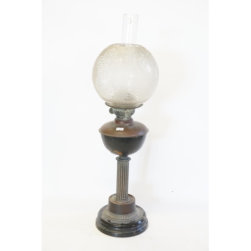 626 - A Victorian Copper & Frosted Glass Oil Lamp with Shade resting on a Carinthium Column base.