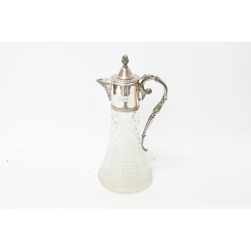 128 - A Claret Jug in the Classical design with a Silver Plated mount marked G and A Hand.