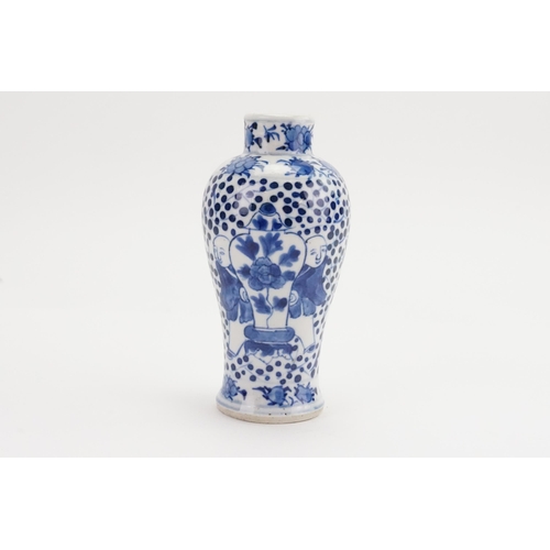 631 - A Chinese Blue & White Vase depicting Children hiding behind a vase. Measuring: 13cms high.