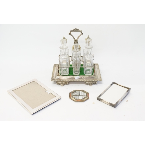 127 - A silver plated condiment set, along with silver plated frames etc.