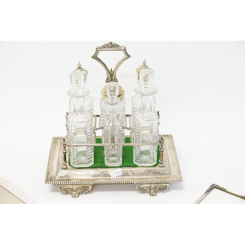 127 - A silver plated condiment set, along with silver plated frames etc.