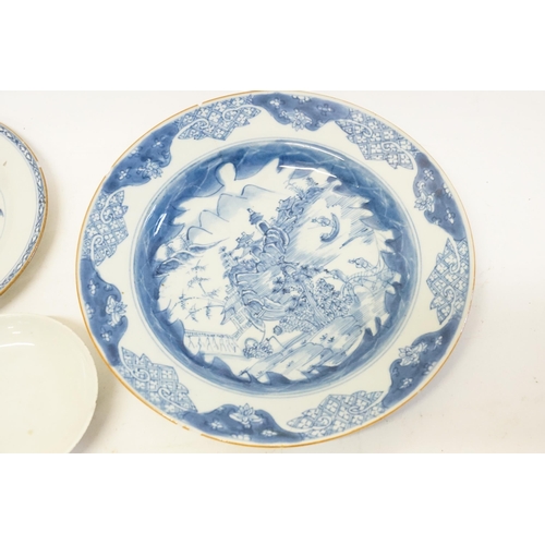 630 - A pair of blue and white Chinese style pin dishes, along with two blue and white plates.