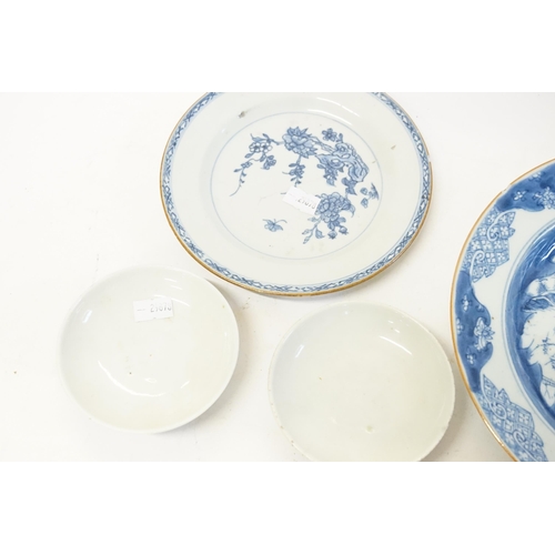 630 - A pair of blue and white Chinese style pin dishes, along with two blue and white plates.