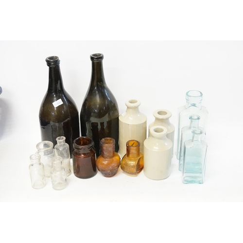 698 - A collection of antique glass bottles.