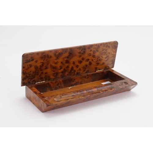 720 - A walnut veneered pen box, and a tortoise shell cameo set box.