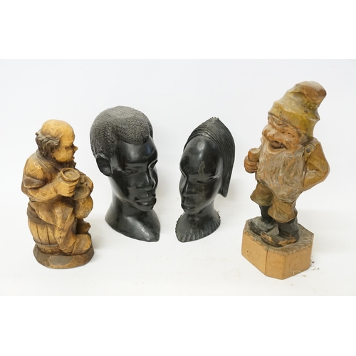 862 - A German Carved Wood Study of a Gnome, a similar Drunk & two Carved African Heads.