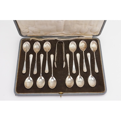 116 - A Set of 12 Silver Plated Shell Bowled Barley Twist Stemmed Tea Spoons in Case.