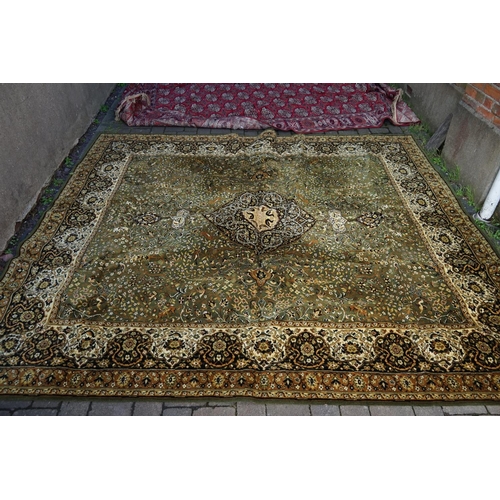 621 - A green ground all over floral patterned Axminster carpet. Measures: 265 x 320