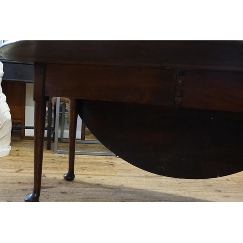 524 - A Georgian Mahogany Drop Flap Dining Table resting on Pad Feet. Measuring: 148cms across x 47cms (Cl... 