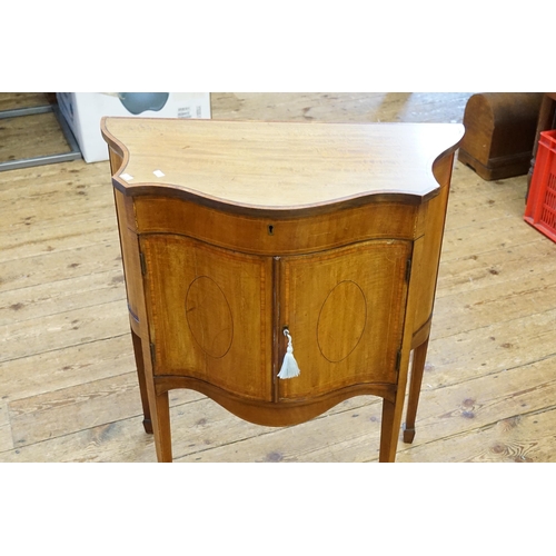 521 - A Edwardian satinwood inlaid bow front vanity sideboard. Resting on square tapering legs and fitted ... 