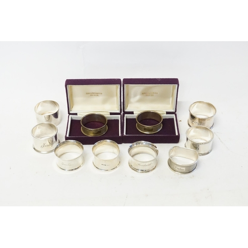 92 - A collection of silver and other napkin rings, engraved with various names, including Richard, Gerti... 