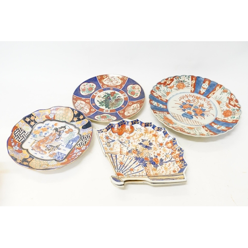 645 - Two Japanese fan shaped serving dishes, along with three plates.