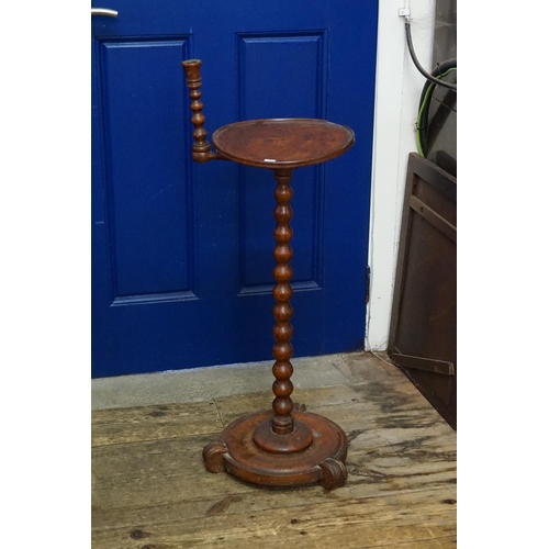 568 - An Early Victorian Honeyed Oak Bobbin Twist Night Table with a Fixed Candle Sconce & resting on a sh... 