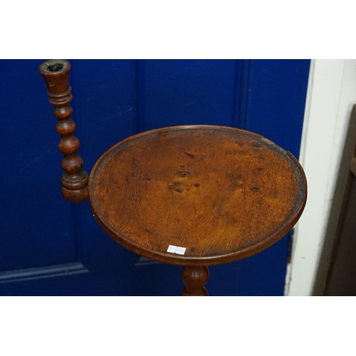 568 - An Early Victorian Honeyed Oak Bobbin Twist Night Table with a Fixed Candle Sconce & resting on a sh... 