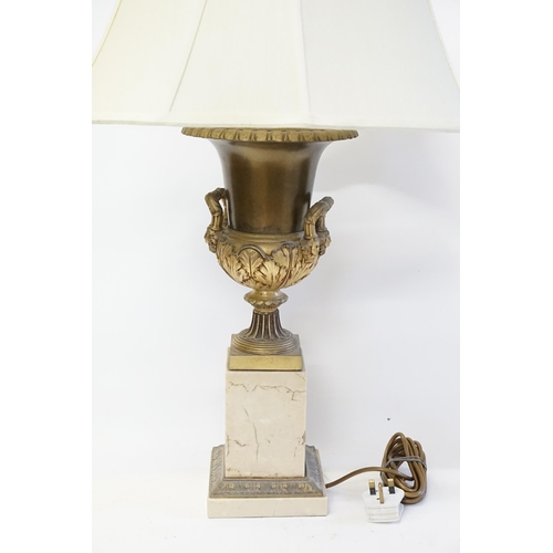 627 - A Marble effect & Urn style Lamp with Shade. Measuring: 60cms high to the bulb.