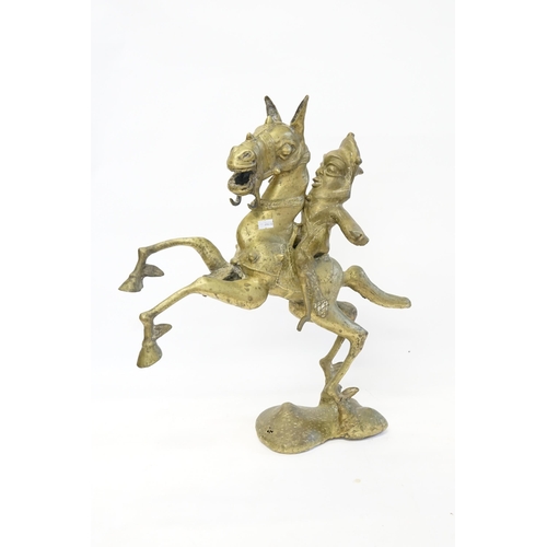 918 - A Benin Study of a Warrior on his Prancing Horse. Measuring: 51cms High.