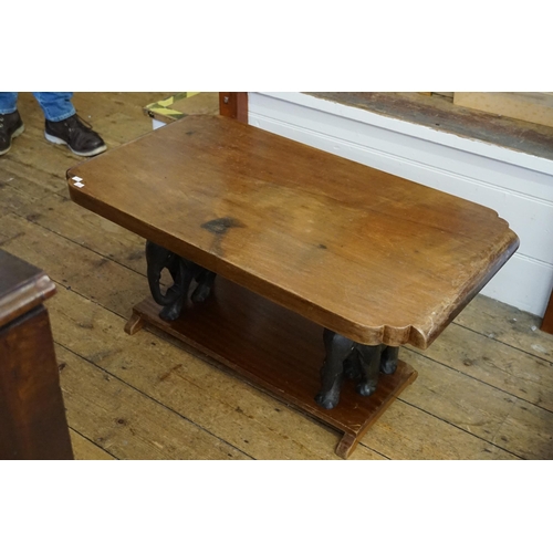 585 - A South African Hardwood Coffee Table with Indian Elephant Supports. Measuring: 90cms across x 50cms... 