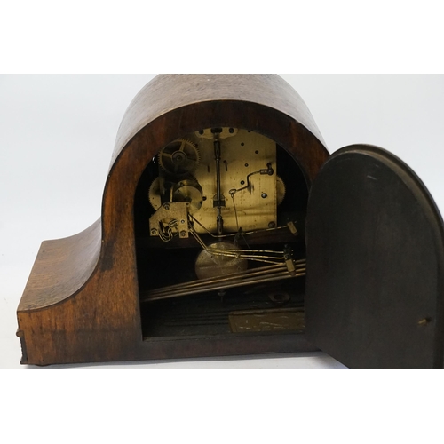 244 - A Oak Cased Wellington Clock with a 