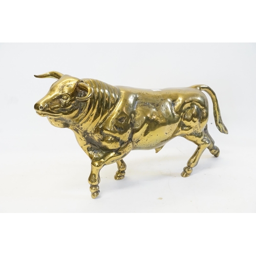 906 - A Very Heavy Brass Study of a Bull. Measuring: 46cms long x 22cms high.