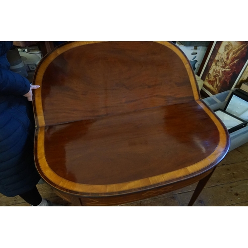 600 - A Georgian Mahogany & Cross Banded Fold Over Top Adams design Tea Table resting on square legs & Spa... 