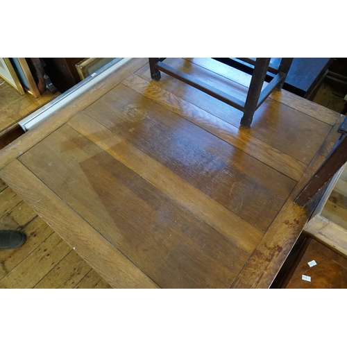 602 - A 1920s Oak Drawer Leaf Table resting on turned legs. Measuring: 91cms across x 80cms high.