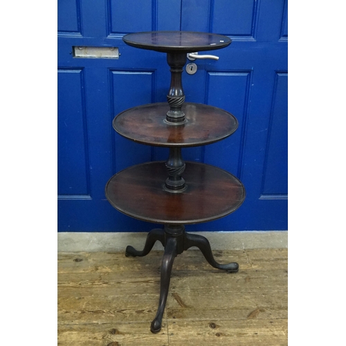 605 - An 18th Century Mahogany Three Tiered Dumb Waiter resting on a Tripod Base. Measuring: 58cms wide to... 