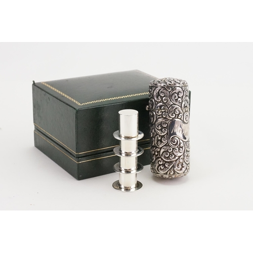 93 - A Silver coloured embossed Perfume Bottle Case containing a Silver Coloured Sewing Set & a Cigarette... 