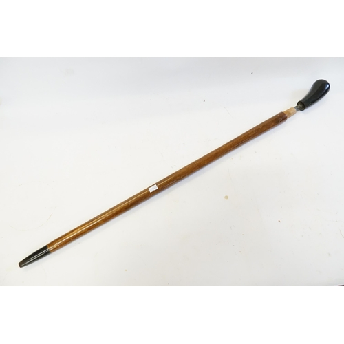 676 - A Black Handled Indian Made Sword Stick Walking Stick.