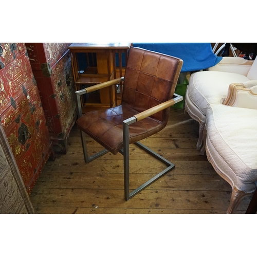 595 - A Steel Framed 1970s Hand Leather Stitched Elbow Chair with padded Seat & Back.