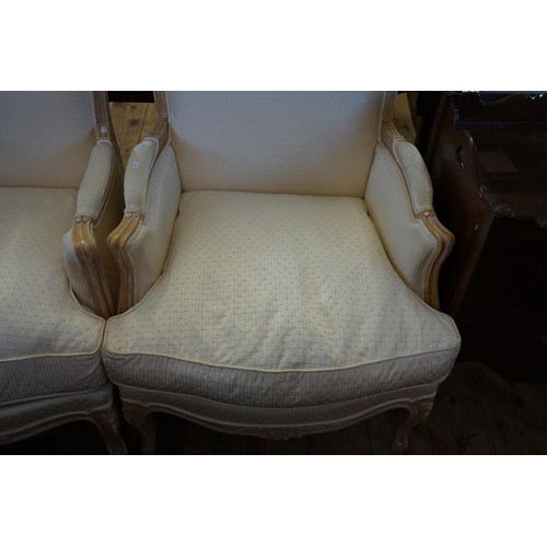 598 - A Pair of French design Beech Lined Fauteuils Chairs upholstered in Cream Damask.