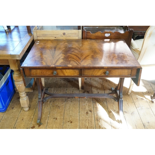 592 - A Cuban Mahogany Veneered Drop-Flap Sofa Table with fitted Drawers & resting on reeded supports. Mea... 