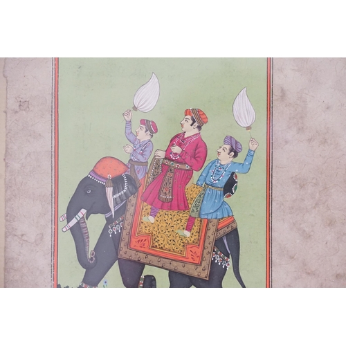 451 - An Indian Parchment painted scene of three men on a bejewelled Elephant with Lanterns & Verse, Frame... 