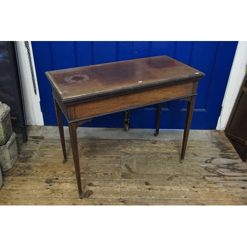 554 - An Edwardian Satinwood inlaid Fold-Over Top Card Table resting on square tapering legs. Measuring: 9... 