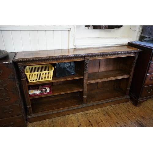 557 - A Victorian Carved Oak Bookcase in the Jacobean style with carved Front. Measuring: 175cms across x ... 