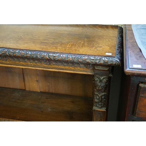 557 - A Victorian Carved Oak Bookcase in the Jacobean style with carved Front. Measuring: 175cms across x ... 