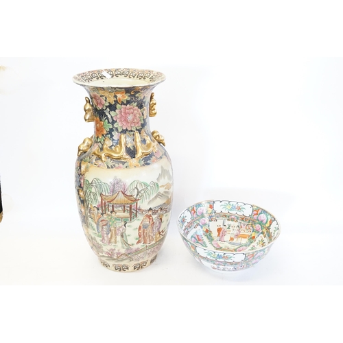 628 - A Cantonese enamelled Punch Bowl & a similar Vase decorated with a landscape.