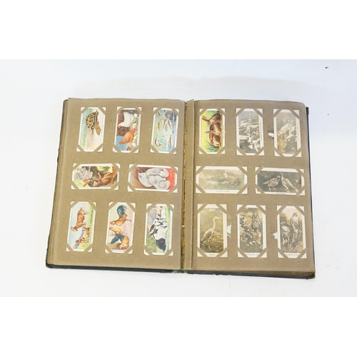 335 - An Early Cigarette Card Album containing various 