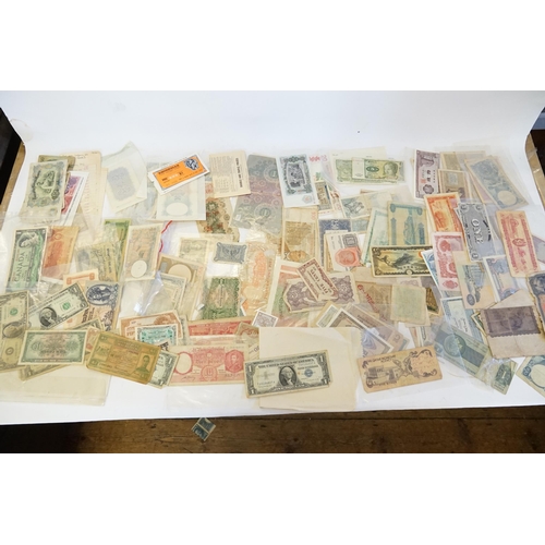 304 - Three Banknote Albums containing Old Banknotes from England, USA, India, Congo, Jamaica, Bahrain, Un... 