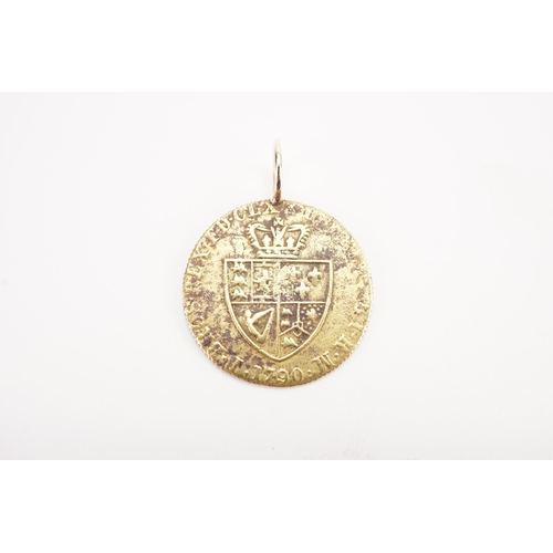 296 - A 1790 Gold coloured guinea token George III. Mounted. Weight 3.5g.