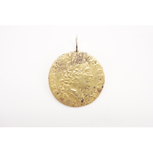 296 - A 1790 Gold coloured guinea token George III. Mounted. Weight 3.5g.