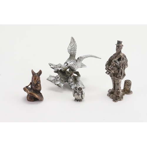 741 - A miniature bronze mouse, along  with three other miniature collectables.