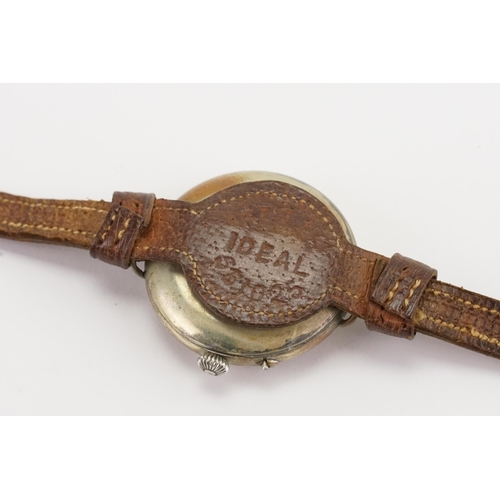 208 - A WWI Gentleman's Rail Road Dial Wristwatch with red and black numerals & leather strap. Marked Reg.... 