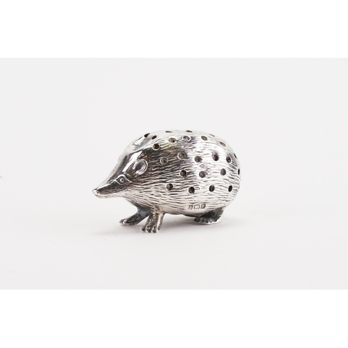 79 - A silver hedgehog pin cushion.