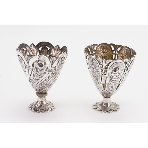 81 - Two silver coloured egg cup holders. Weight 62g.