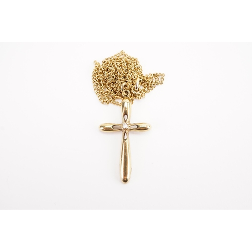 168 - A 9ct gold diamond set cross pendant, on plated chain.