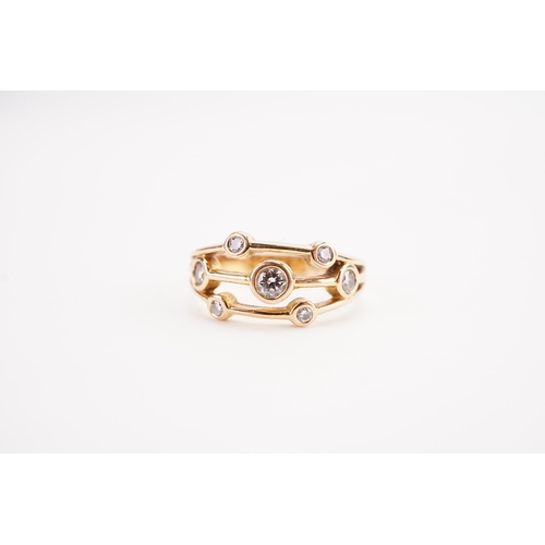 160 - A 18ct rose gold and diamond set ring, set with seven diamonds. Weight 4.5g. Size O.