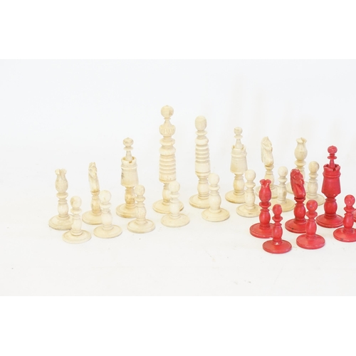 743 - An Antique Wooden Red and Cream Chess Set. (Complete).