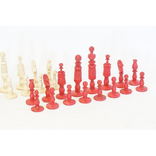 743 - An Antique Wooden Red and Cream Chess Set. (Complete).